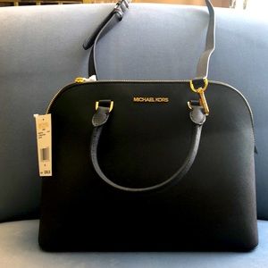 Michael Kors leather dome satchel with strap & handles. Gold tone hardware.
